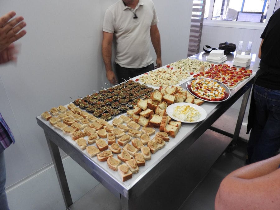 man tasting delicies with avgotaraho on the table from Bottarga Stefos